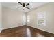 Bedroom with high ceiling, hardwood floors, and natural light at 3100 Templeton Ln, Loganville, GA 30052