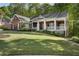 Beautiful brick home featuring a spacious front porch, perfect for relaxing outdoors at 3100 Templeton Ln, Loganville, GA 30052