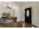 Elegant foyer with hardwood floors and a view to a well-lit sitting room at 3100 Templeton Ln, Loganville, GA 30052