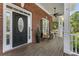 Inviting front porch with outdoor seating and a view of the lush surroundings at 3100 Templeton Ln, Loganville, GA 30052