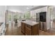 Spacious kitchen with island, stainless steel appliances, and ample natural light at 3100 Templeton Ln, Loganville, GA 30052
