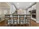 Kitchen featuring a bar with seating and open to the living room at 3100 Templeton Ln, Loganville, GA 30052