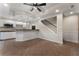 Finished basement with kitchenette, breakfast bar, and stairs to the upper level at 3100 Templeton Ln, Loganville, GA 30052