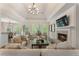 Sunlit living room boasts hardwood floors, a fireplace, and an open concept layout with great natural light at 3100 Templeton Ln, Loganville, GA 30052