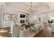 Inviting living room features a fireplace, high ceilings, hardwood floors, and lots of natural light at 3100 Templeton Ln, Loganville, GA 30052