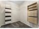 Spacious walk-in closet with built-in storage and shelving at 3100 Templeton Ln, Loganville, GA 30052
