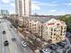 Overhead view of The Alhambra building and surrounding neighborhood, highlighting its urban location and nearby amenities at 2855 Peachtree Ne Rd # 115, Atlanta, GA 30305