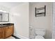 Clean bathroom featuring a vanity, toilet, and open storage, providing a practical space with essential amenities at 2855 Peachtree Ne Rd # 115, Atlanta, GA 30305
