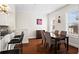 Cozy dining area with bar seating near the kitchen and a dining table set for four at 2855 Peachtree Ne Rd # 115, Atlanta, GA 30305