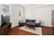 Comfortable living room showcasing a sectional sofa, coffee table, and natural light at 2855 Peachtree Ne Rd # 115, Atlanta, GA 30305