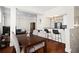 Bright, open-concept living space featuring hardwood floors, breakfast bar, and a dining table at 2855 Peachtree Ne Rd # 115, Atlanta, GA 30305