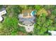 Aerial view of an estate featuring a pool and a meticulously landscaped yard with mature trees at 3835 Paces Ferry Nw Rd, Atlanta, GA 30327