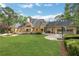 Expansive backyard with lush lawn, fountain, patio, and basketball hoop, perfect for outdoor enjoyment at 3835 Paces Ferry Nw Rd, Atlanta, GA 30327