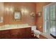 Traditional half bathroom with floral wallpaper and dark wood vanity at 3835 Paces Ferry Nw Rd, Atlanta, GA 30327