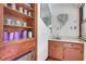 Unique bathroom featuring built in shelving, and a vanity with a sink at 3835 Paces Ferry Nw Rd, Atlanta, GA 30327