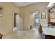 Spacious bathroom with marble floors, vanity with mirror, and walk-in shower visible in the background at 3835 Paces Ferry Nw Rd, Atlanta, GA 30327