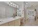 Bright bathroom featuring a vanity with plenty of counter space and storage underneath at 3835 Paces Ferry Nw Rd, Atlanta, GA 30327