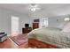 Spacious bedroom with hardwood floors, a ceiling fan, and an oriental rug at 3835 Paces Ferry Nw Rd, Atlanta, GA 30327