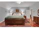 Bedroom with hardwood floors, ceiling fan, and a bed with storage drawers underneath at 3835 Paces Ferry Nw Rd, Atlanta, GA 30327