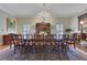 Spacious dining room featuring a long table, chandelier, and natural light at 3835 Paces Ferry Nw Rd, Atlanta, GA 30327
