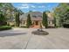 Expansive home with mature evergreens, beautiful front yard fountain and long, curved driveway at 3835 Paces Ferry Nw Rd, Atlanta, GA 30327