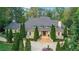 Stunning traditional two-story home featuring a symmetrical facade, manicured landscaping, and elegant entryway at 3835 Paces Ferry Nw Rd, Atlanta, GA 30327