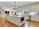 Bright kitchen with island, stainless steel appliances and white cabinetry at 3835 Paces Ferry Nw Rd, Atlanta, GA 30327