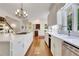 Bright kitchen featuring a cooktop, ample counter space, and views to other rooms at 3835 Paces Ferry Nw Rd, Atlanta, GA 30327