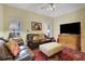 Inviting living room with leather sofas, an area rug and neutral color palette at 3835 Paces Ferry Nw Rd, Atlanta, GA 30327