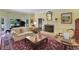 Cozy living room featuring a fireplace, piano, and comfortable seating at 3835 Paces Ferry Nw Rd, Atlanta, GA 30327