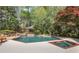 Backyard pool and spa featuring a pool house and mature trees at 3835 Paces Ferry Nw Rd, Atlanta, GA 30327