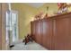 A room with wooden wardrobes and a window with slatted blinds providing natural light at 3835 Paces Ferry Nw Rd, Atlanta, GA 30327