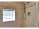 Walk-in shower featuring mosaic tile accent and a rainfall showerhead with glass block window at 3835 Paces Ferry Nw Rd, Atlanta, GA 30327