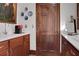 Classic wet bar with sink, dark wood cabinets and stylish lighting at 3835 Paces Ferry Nw Rd, Atlanta, GA 30327
