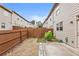 Backyard features concrete patio, planting, and private fencing at 5016 Whiteoak Se Pointe, Smyrna, GA 30080