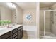 Ensuite bathroom featuring double sinks, soaking tub, and a separate shower at 5016 Whiteoak Se Pointe, Smyrna, GA 30080