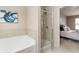 Ensuite bathroom with tub and a separate shower featuring tile walls at 5016 Whiteoak Se Pointe, Smyrna, GA 30080