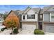 Charming two-story home with a two-car garage and a well-maintained front yard, perfect for suburban living at 5016 Whiteoak Se Pointe, Smyrna, GA 30080
