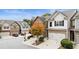 Exterior view showcasing townhome architecture, tree, two-car garage, and landscaped front yard at 5016 Whiteoak Se Pointe, Smyrna, GA 30080