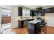 Modern kitchen featuring dark cabinets, granite counters and a stainless steel dishwasher at 5016 Whiteoak Se Pointe, Smyrna, GA 30080