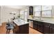 Kitchen island with granite countertops and seating, leading to dining area at 5016 Whiteoak Se Pointe, Smyrna, GA 30080