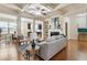 Open-concept living room seamlessly connected to the dining area and kitchen, perfect for modern living and entertaining guests at 5016 Whiteoak Se Pointe, Smyrna, GA 30080