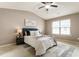 Spacious main bedroom with a large area rug, vaulted ceiling, and picture window at 5016 Whiteoak Se Pointe, Smyrna, GA 30080