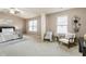Comfortable main bedroom featuring a vaulted ceiling, ceiling fan, and seating area at 5016 Whiteoak Se Pointe, Smyrna, GA 30080