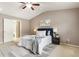 Inviting main bedroom with an ensuite bathroom and decorative ceiling fan at 5016 Whiteoak Se Pointe, Smyrna, GA 30080