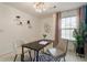 Bright home office features modern light fixture, neutral decor, and a cozy area rug at 5016 Whiteoak Se Pointe, Smyrna, GA 30080