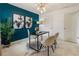 Stylish home office with dark accent wall, globe, and zebra hide rug at 5016 Whiteoak Se Pointe, Smyrna, GA 30080