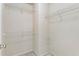 Walk-in closet featuring wire shelving with an access door to the ensuite bathroom at 5016 Whiteoak Se Pointe, Smyrna, GA 30080