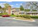 Well-maintained apartment exterior featuring lush greenery and assigned parking at 5638 River Heights Se Xing, Marietta, GA 30067