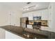 Bright kitchen features granite counters, stainless steel appliances, and white cabinetry at 5638 River Heights Se Xing, Marietta, GA 30067